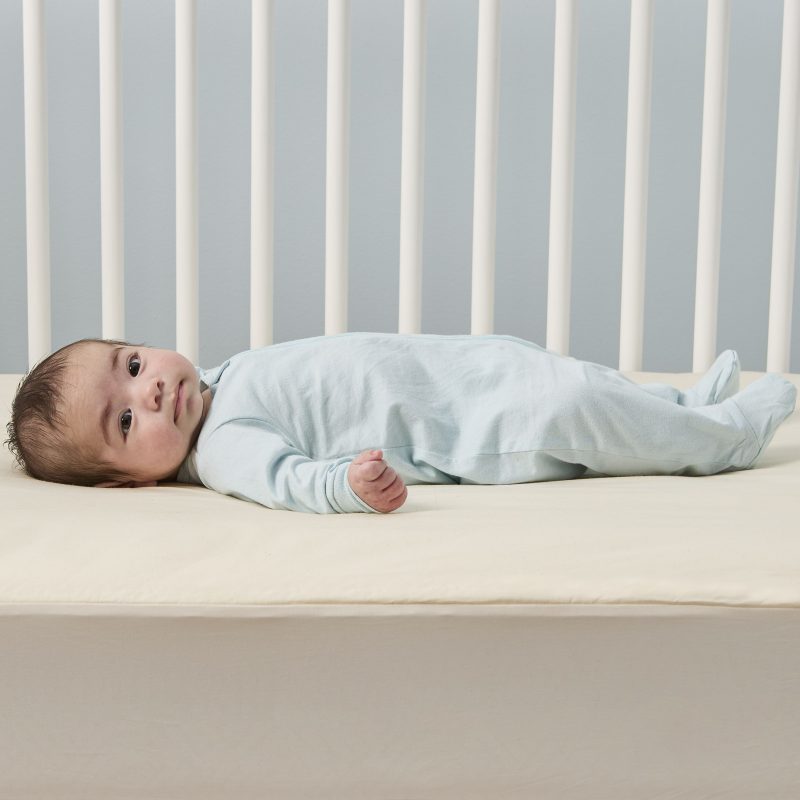Baby on mattress pad