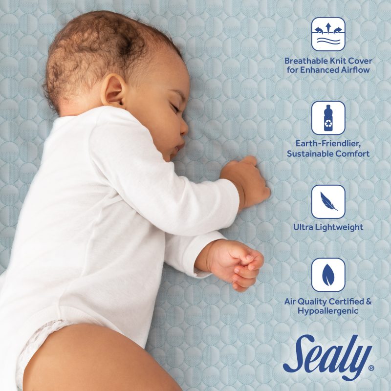 sleeping baby on breathable mattress for crib